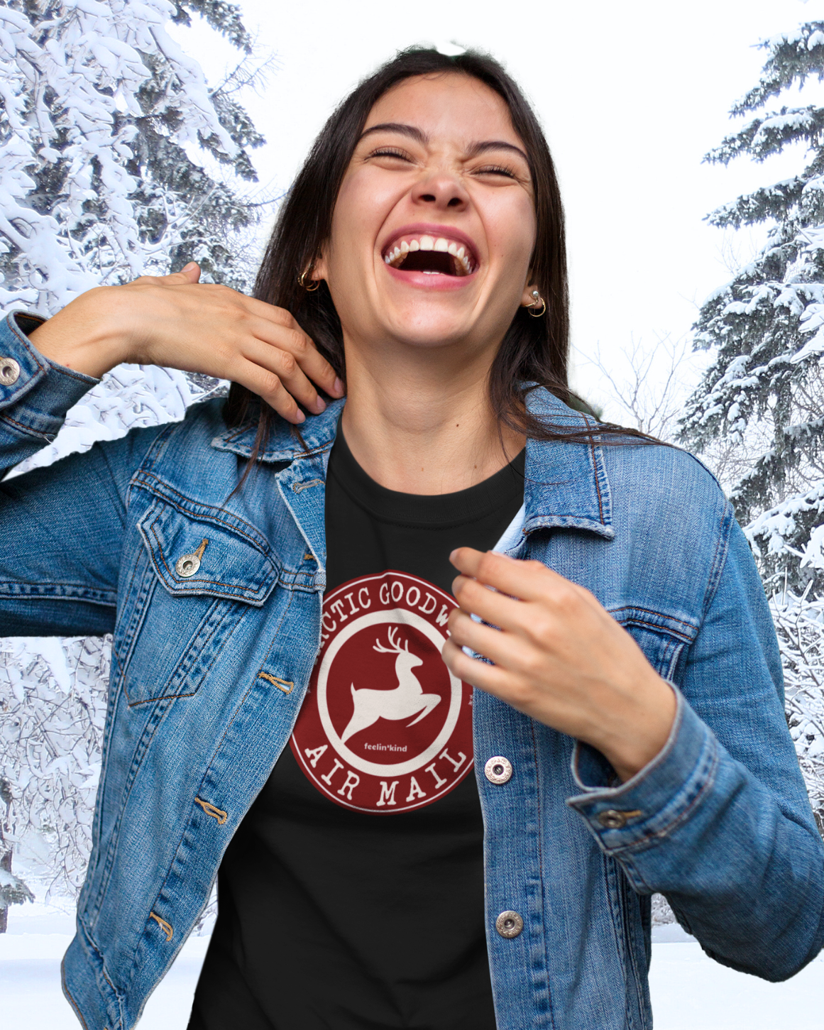 Young Woman wearing Arctic Goodwill Air Mail unisex t-shirt of a majestic deer leaping embodies strength and kindness in a wilderness-inspired design.